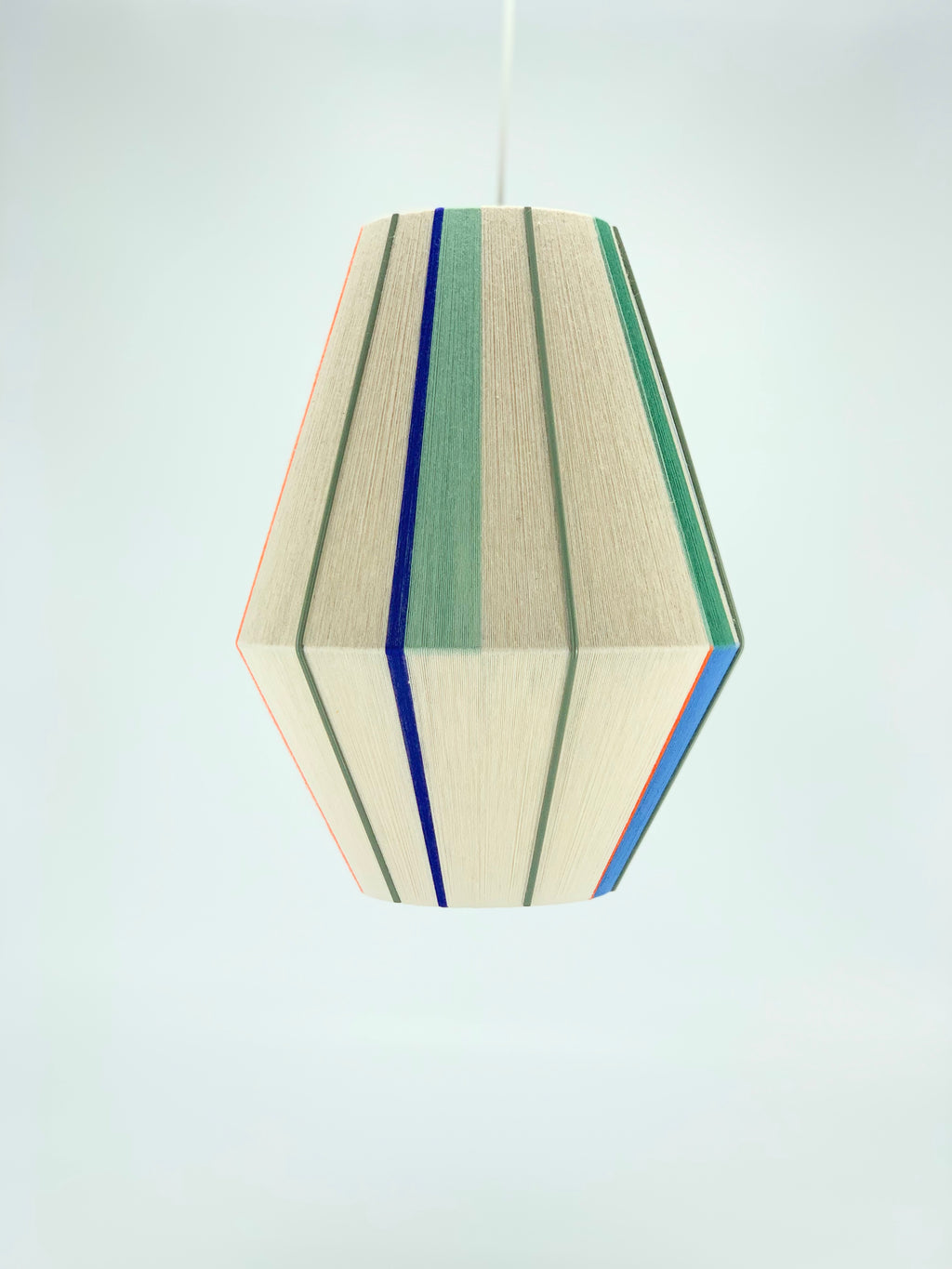 Luca Baya pendant light handwoven in navy, mustard, lilac, and natural yarns by Skye Lightly
