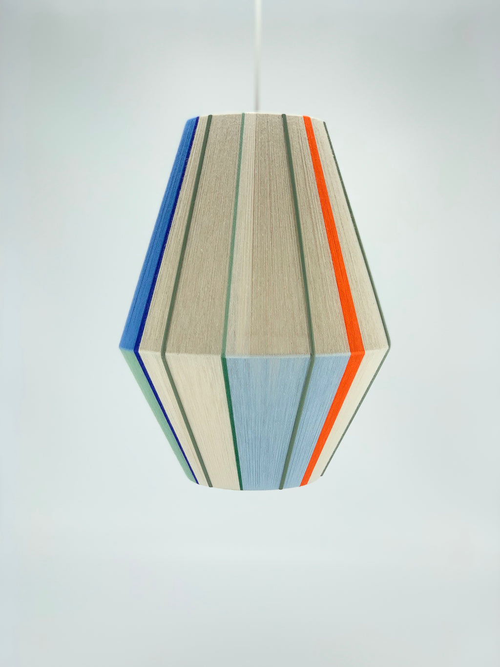 Luca Baya pendant light handwoven in navy, mustard, lilac, and natural yarns by Skye Lightly 1