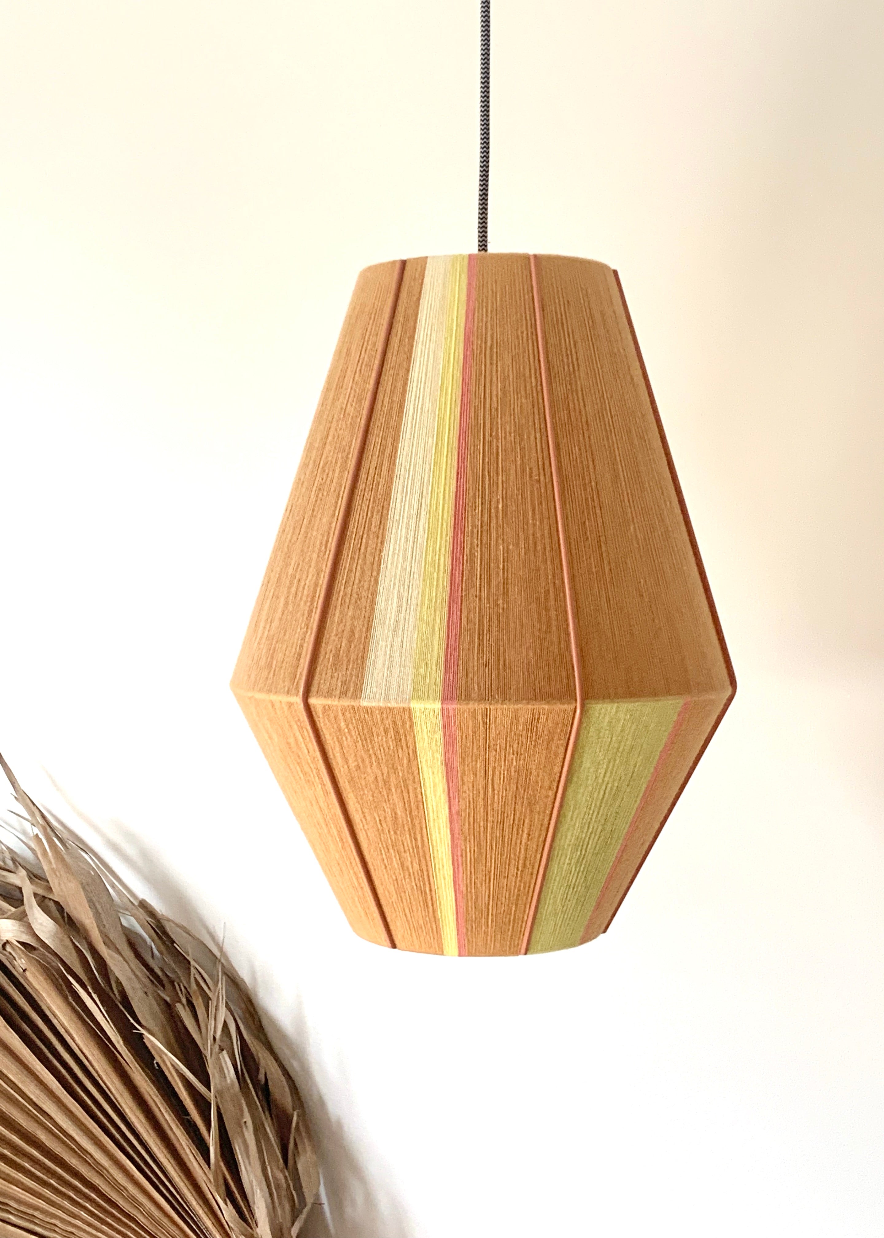 Lucy Baya pendant light handwoven in soft pink, lavender, mint and natural yarns by Skye Lightly
