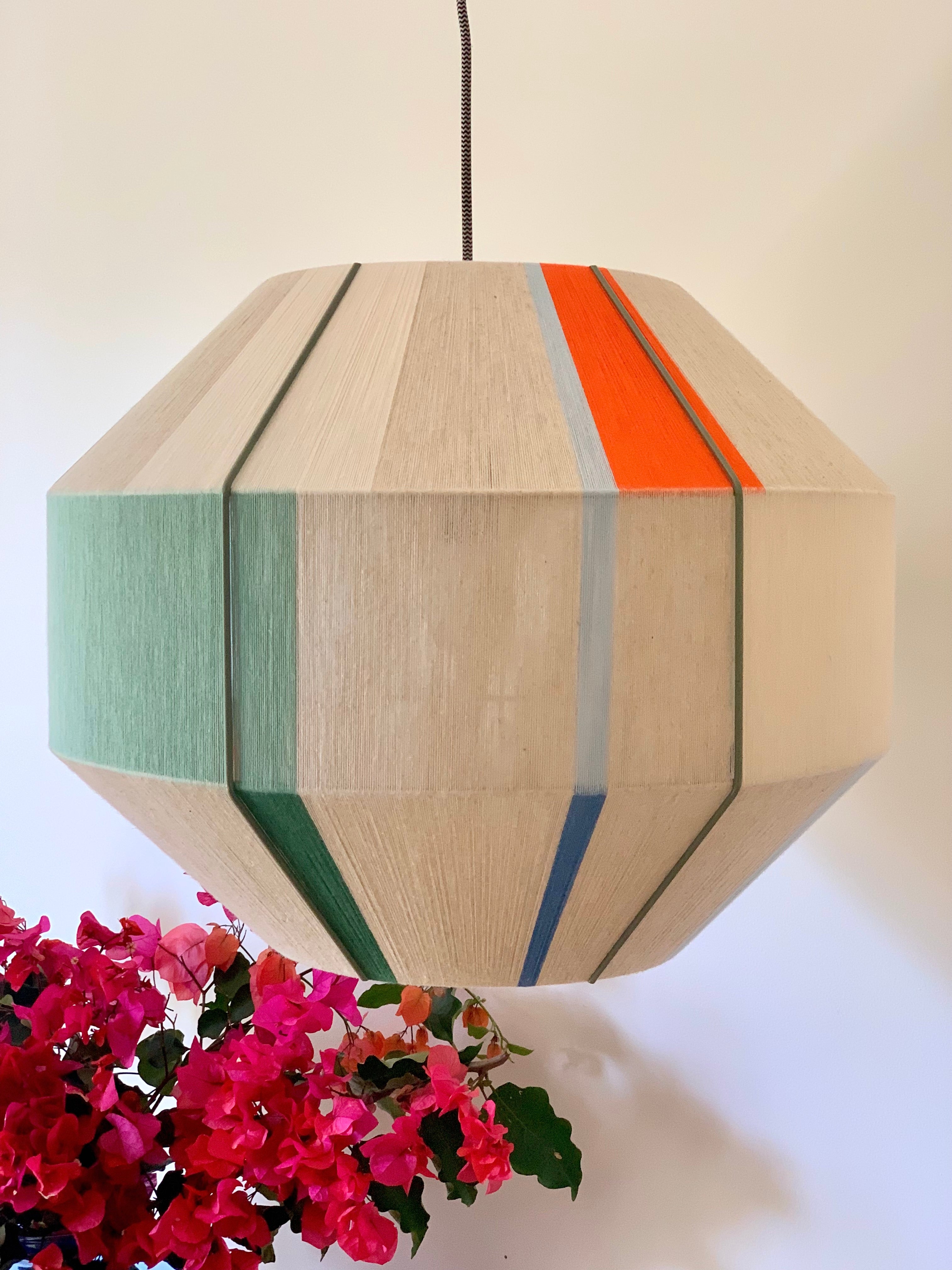 Mirkarla Hive pendant light handwoven in pink, raspberry, peach and natural yarns by Skye Lightly

