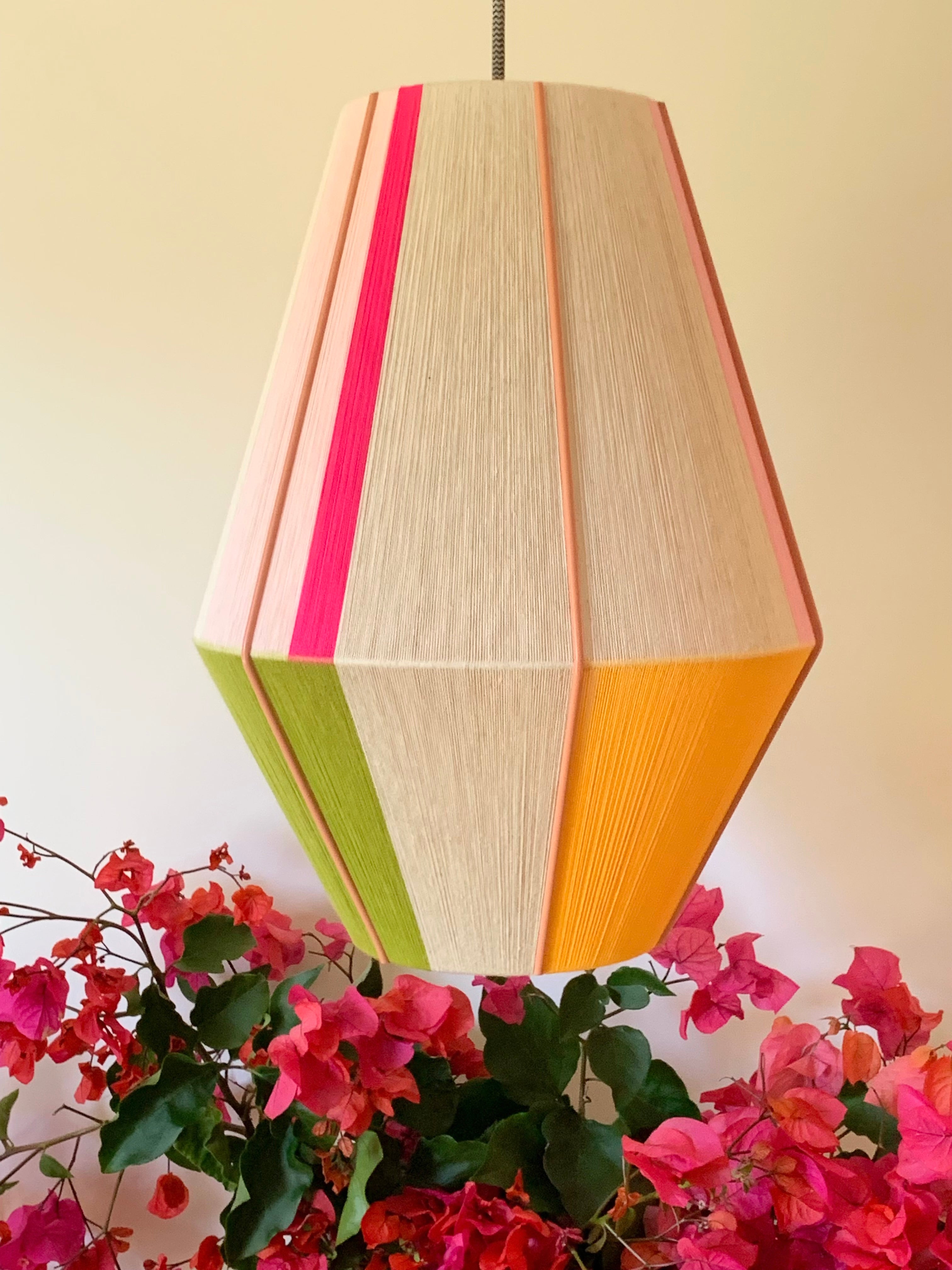 Lifestyle 3 of Sofia Baya pendant light handwoven in blush, lavender, buttercup yellow, and natural yarns by Skye Lightly
