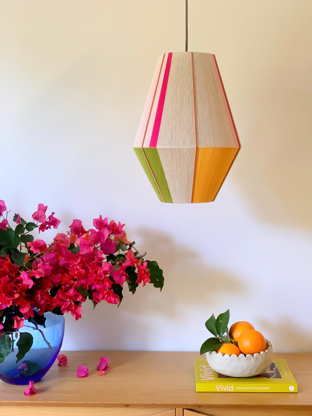 Lifestyle Sofia Baya pendant light handwoven in blush, lavender, buttercup yellow, and natural yarns by Skye Lightly
