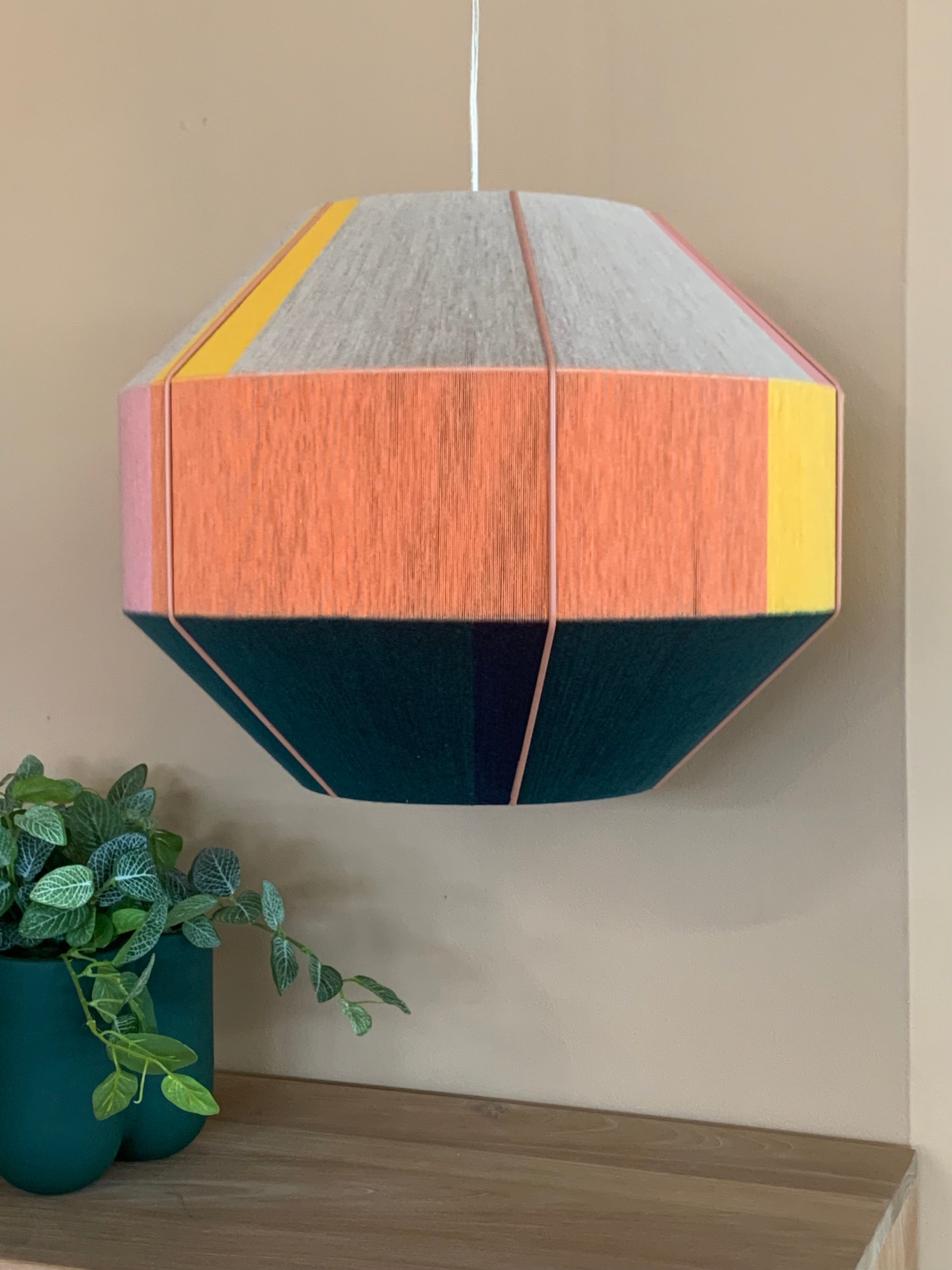 Stephanie Hive pendant light handwoven in buttercup yellow, lavender, salmon, and natural yarns by Skye Lightly 2