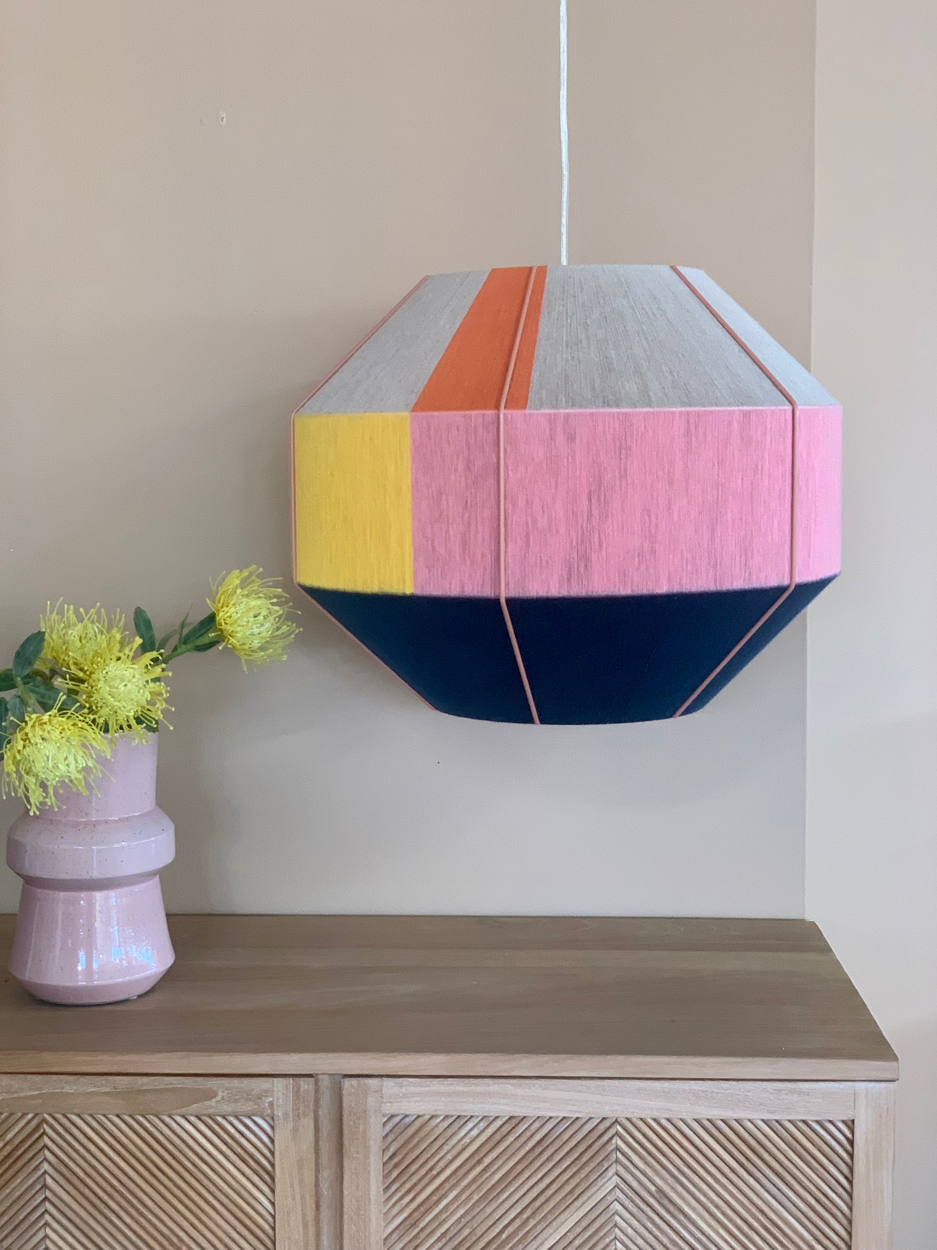 Stephanie Hive pendant light handwoven in buttercup yellow, lavender, salmon, and natural yarns by Skye Lightly 3