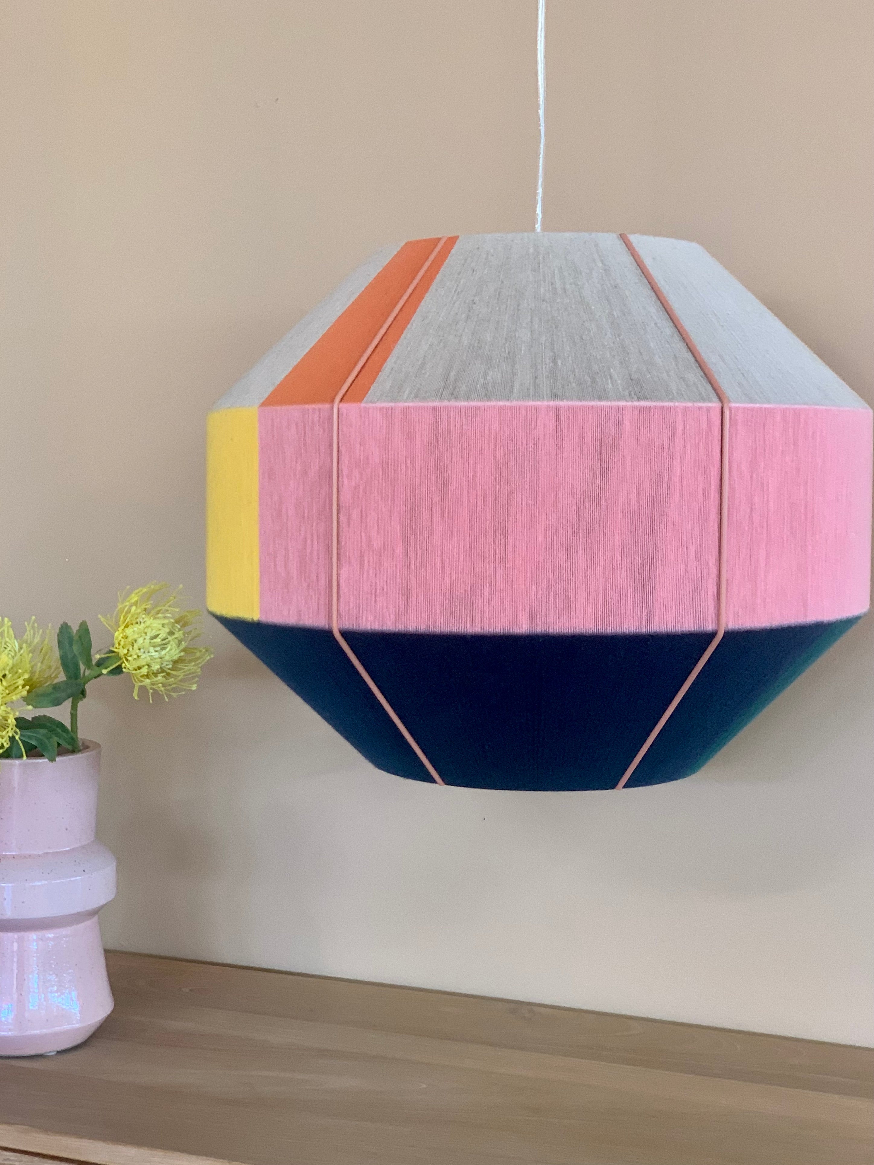 Stephanie Hive pendant light handwoven in buttercup yellow, lavender, salmon, and natural yarns by Skye Lightly 4