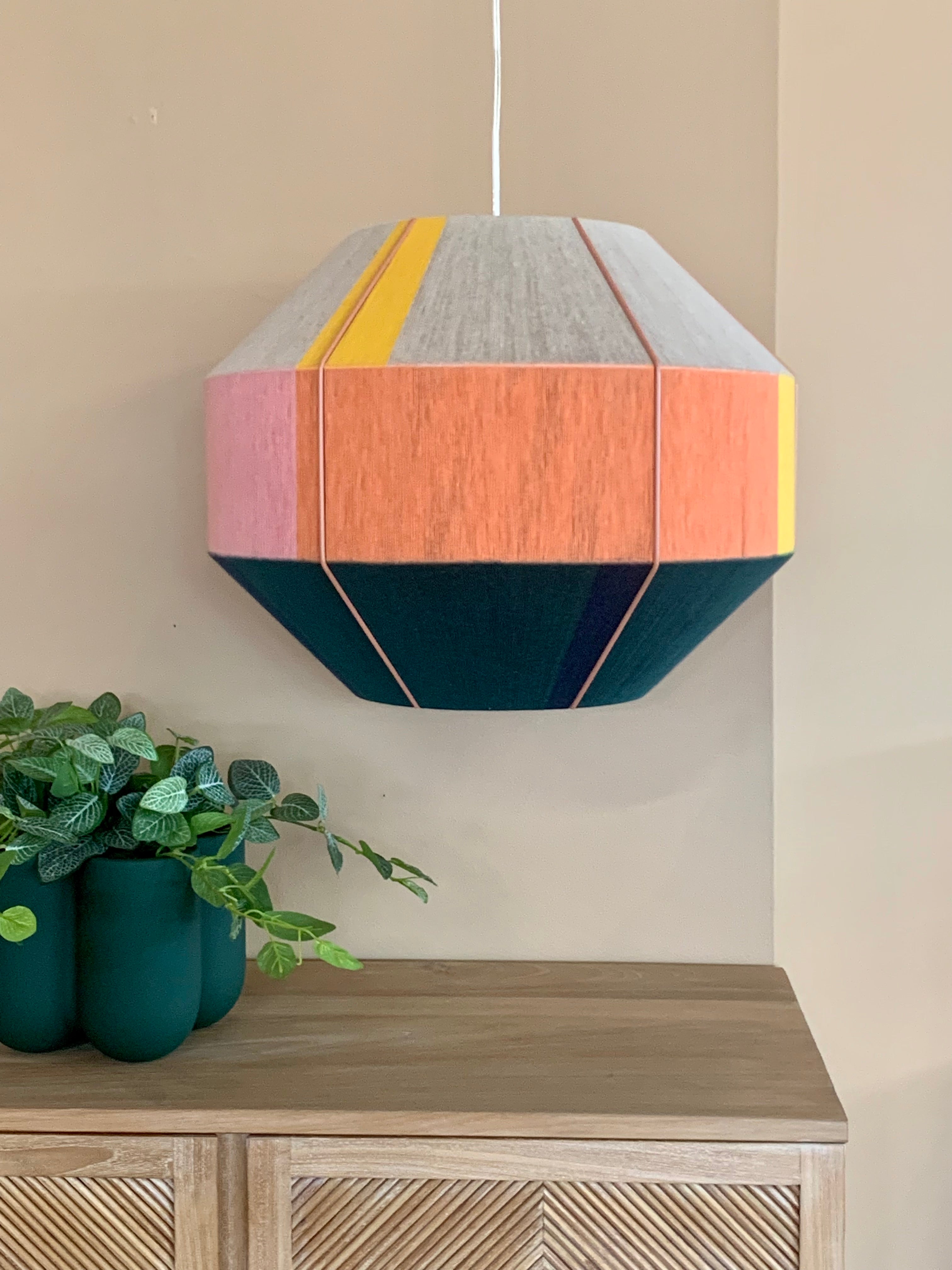 Stephanie Hive pendant light handwoven in buttercup yellow, lavender, salmon, and natural yarns by Skye Lightly 1
