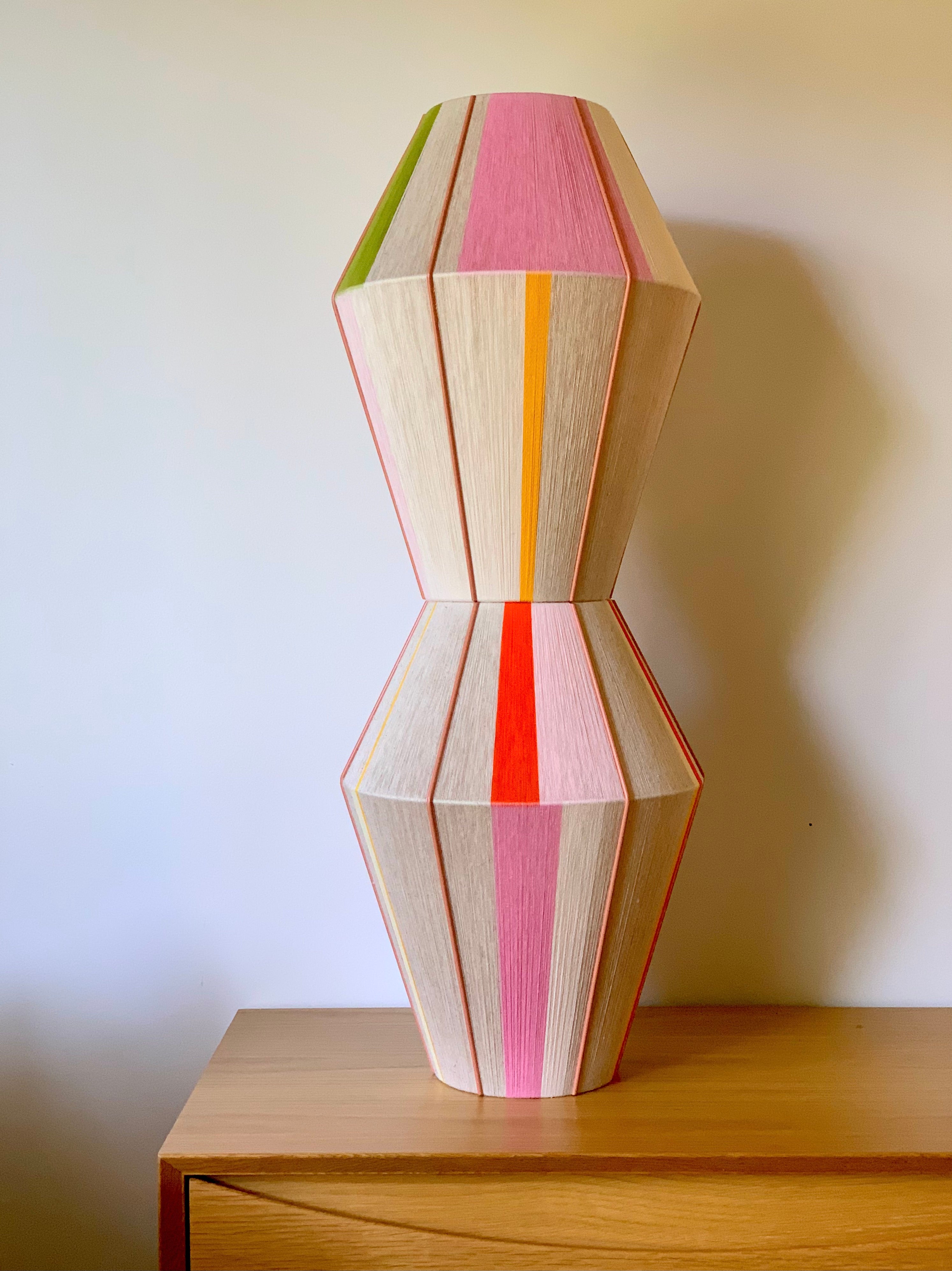 collection shot viewing Valentina handwoven pendant light in coral, mustard, and eucalyptus yarns by Skye Lightly