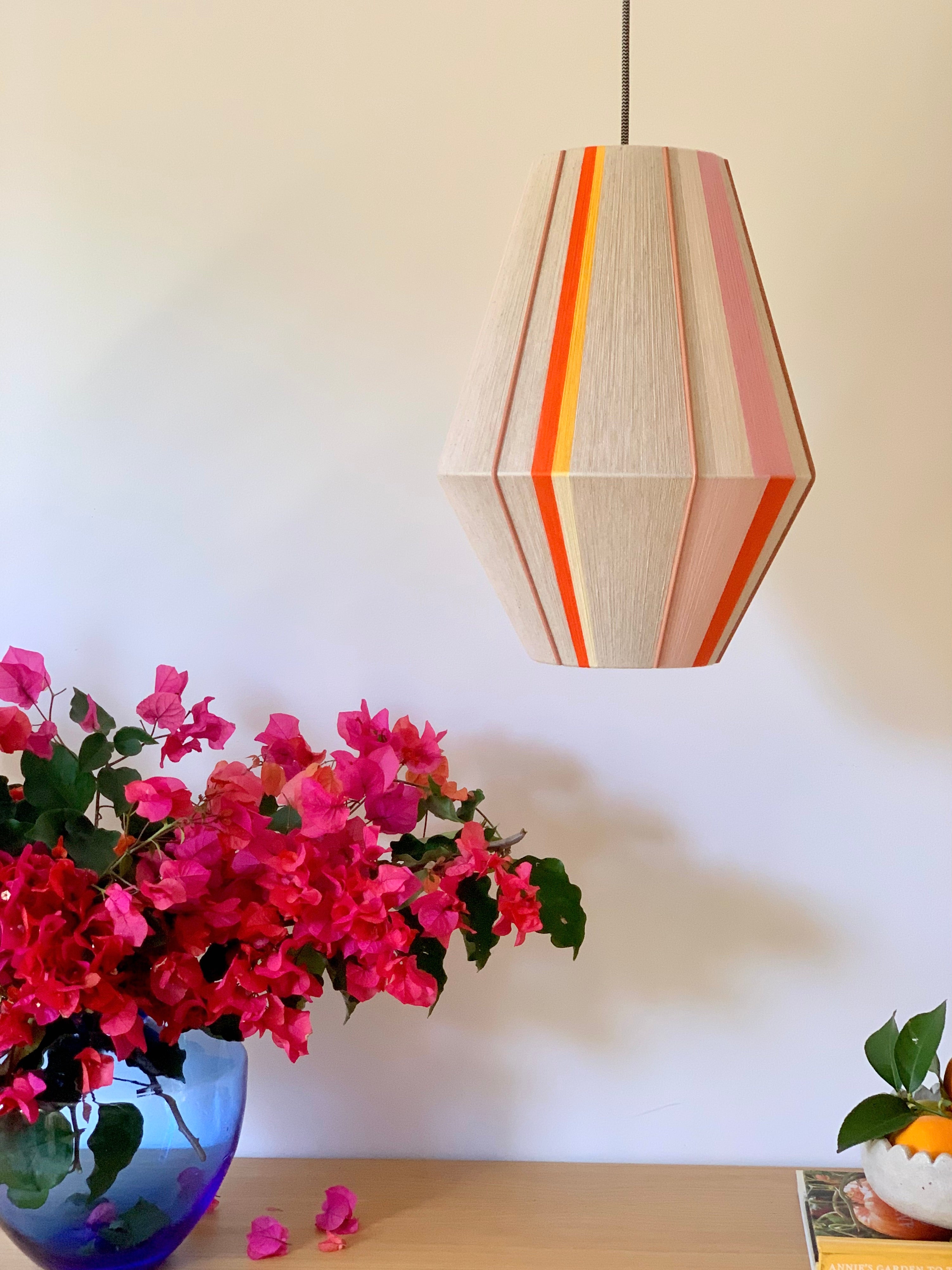Valentina handwoven pendant light in coral, mustard, and eucalyptus yarns by Skye Lightly