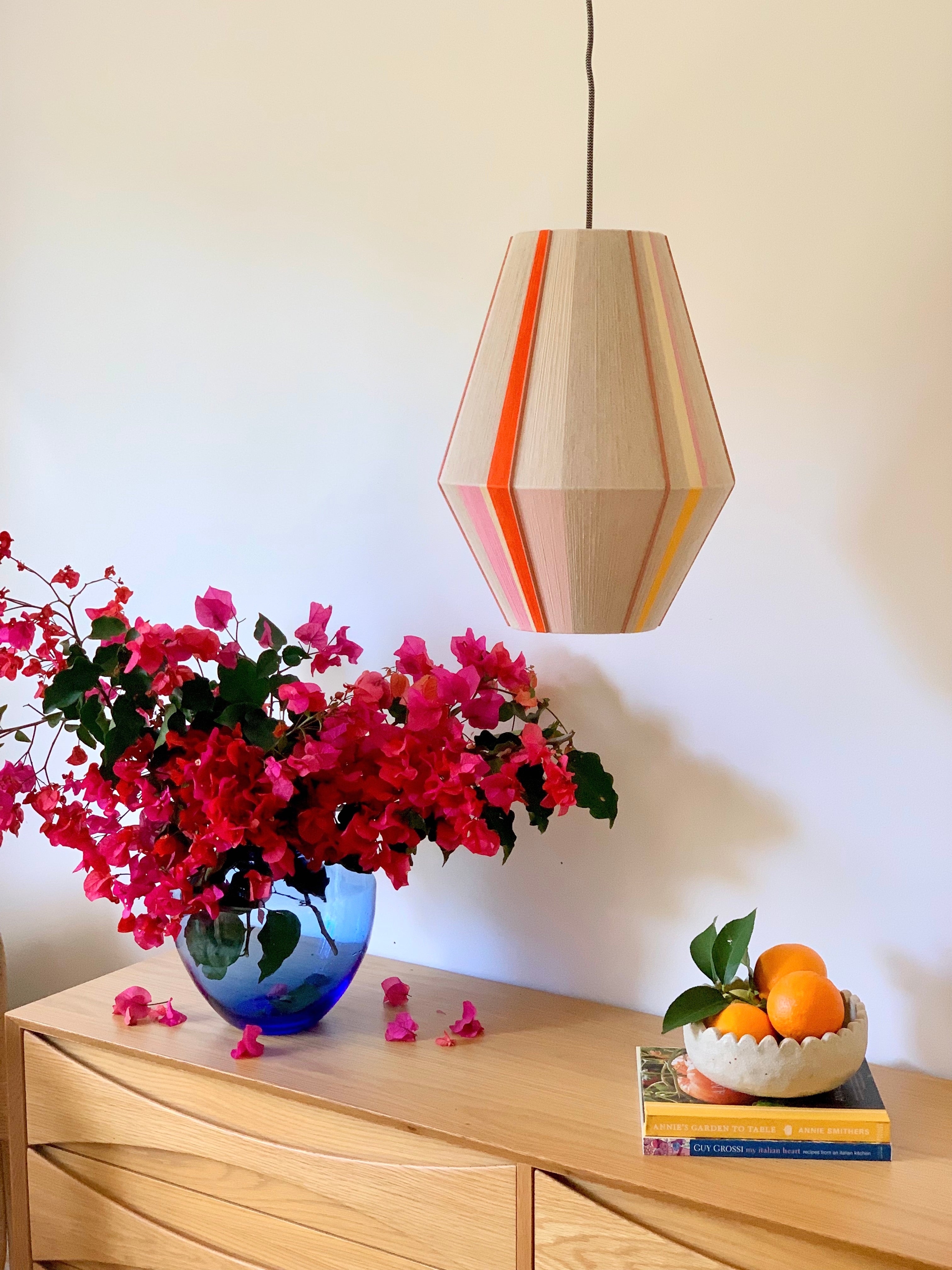 Valentina handwoven pendant light in coral, mustard, and eucalyptus yarns by Skye Lightly