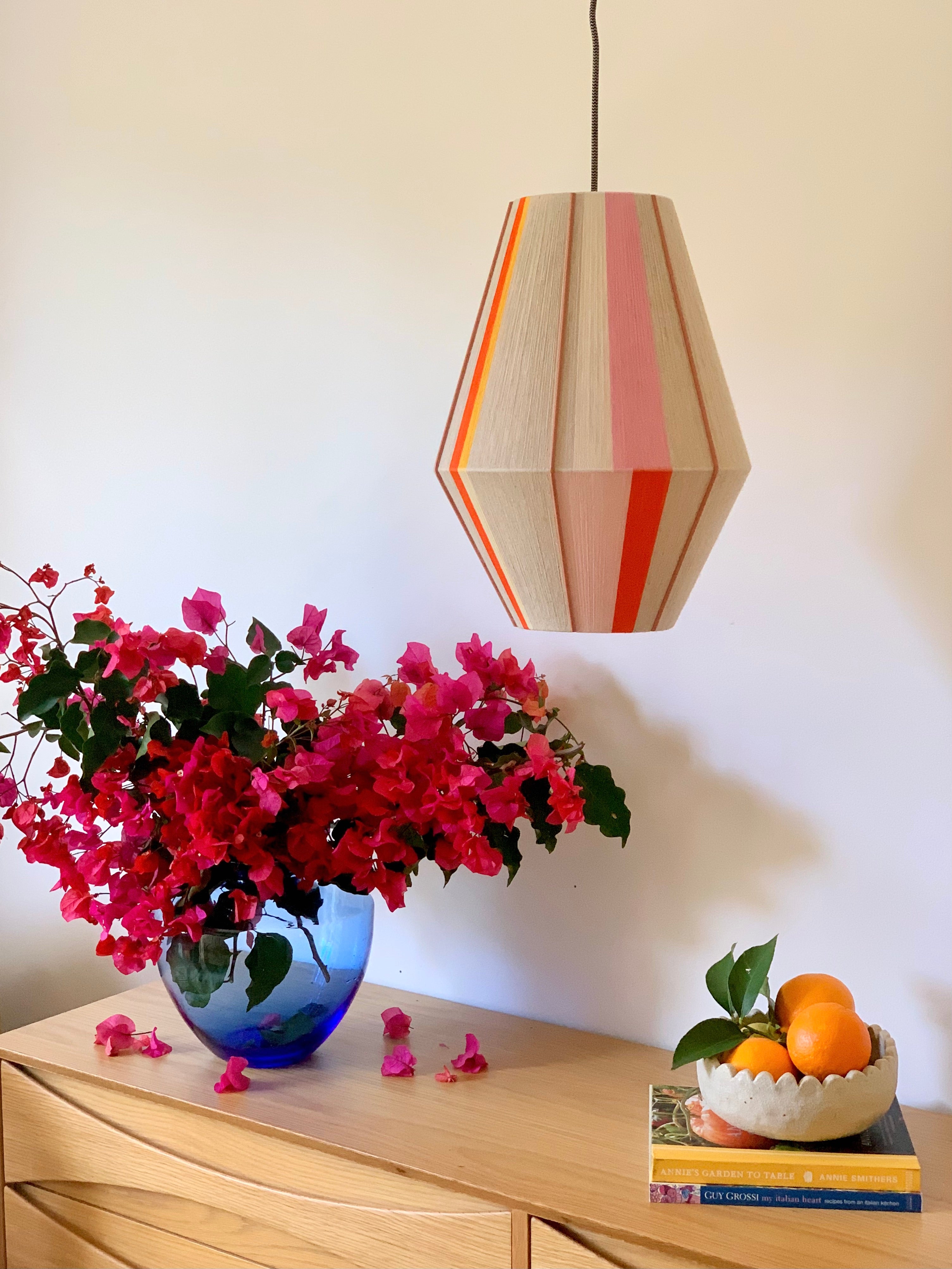 Valentina handwoven pendant light in coral, mustard, and eucalyptus yarns by Skye Lightly
