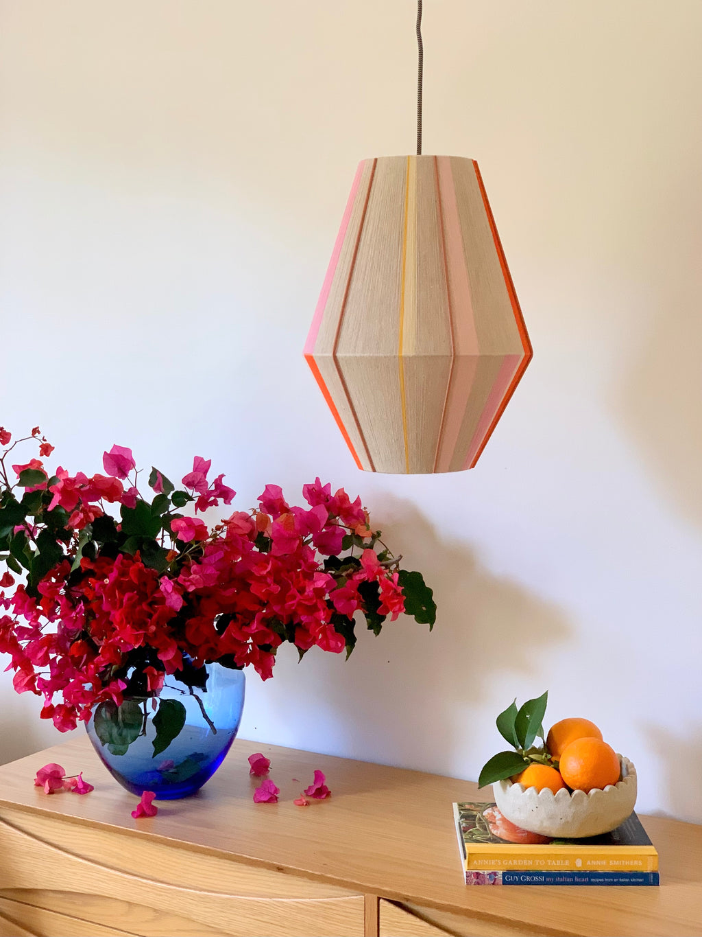Valentina handwoven pendant light in coral, mustard, and eucalyptus yarns by Skye Lightly