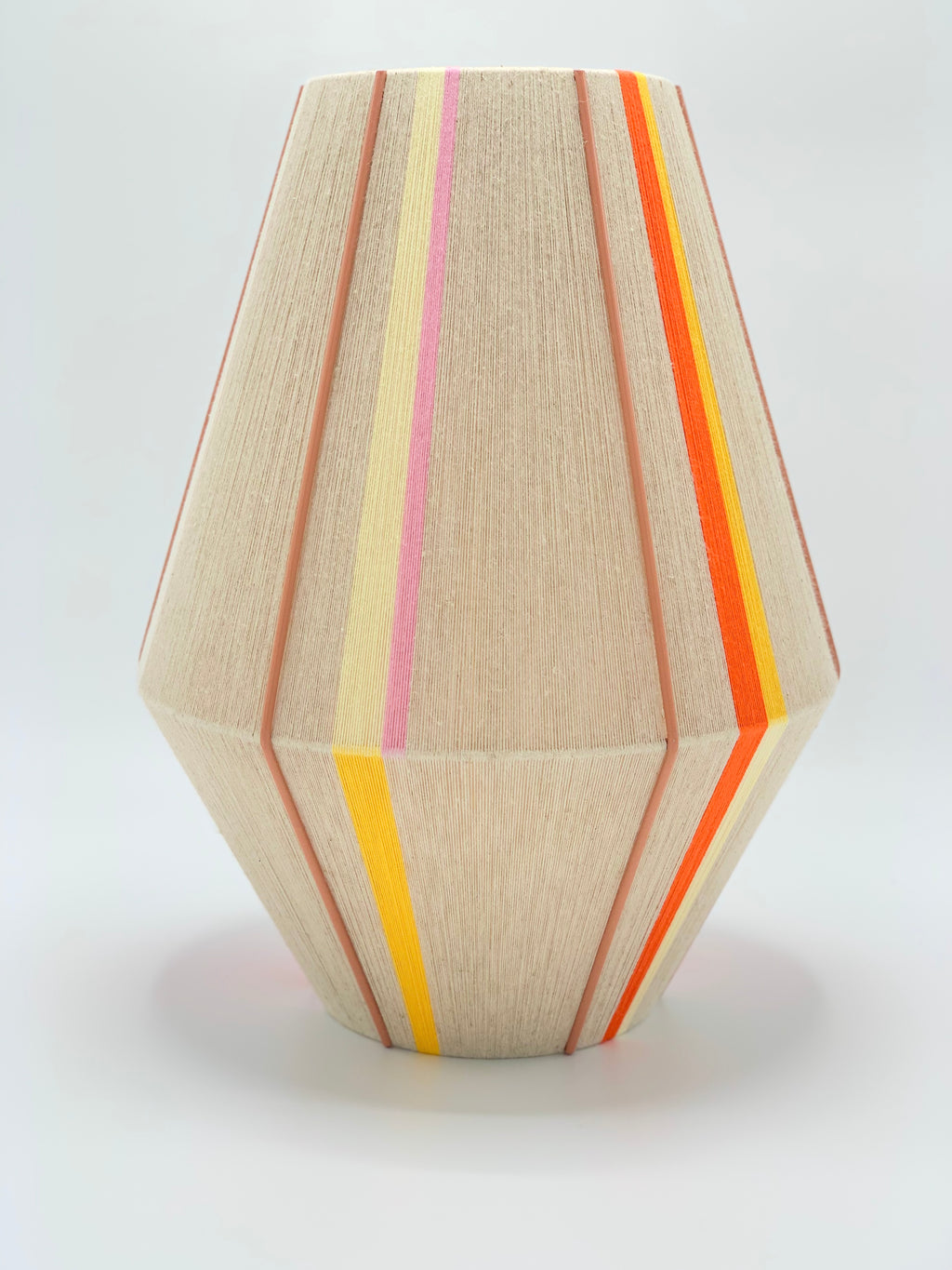 Valentina handwoven pendant light in coral, mustard, and eucalyptus yarns by Skye Lightly