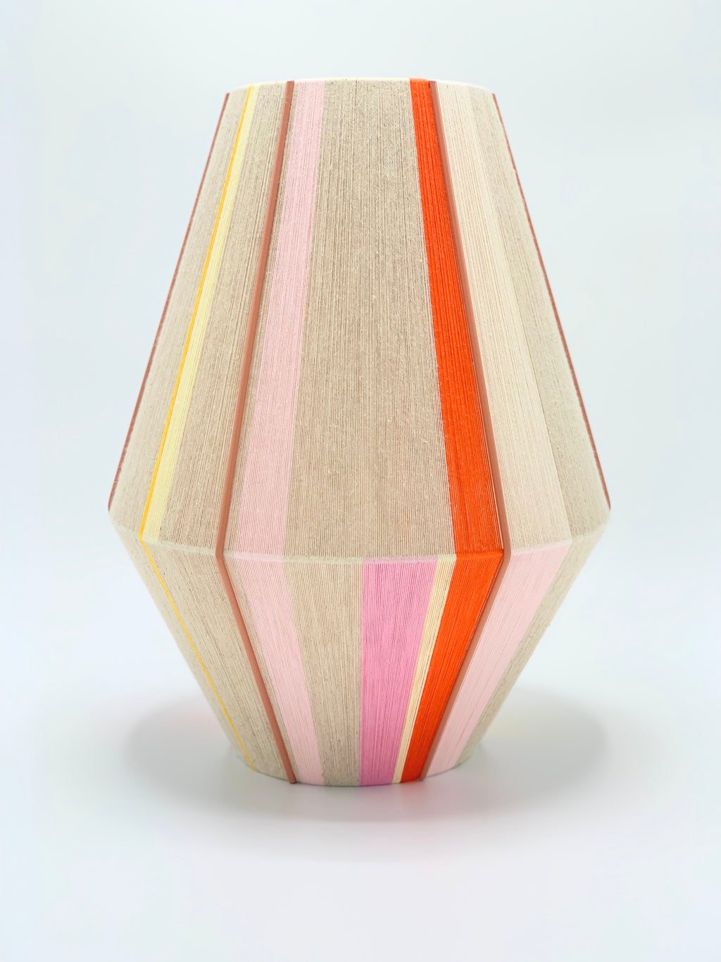 Valentina handwoven pendant light in coral, mustard, and eucalyptus yarns by Skye Lightly